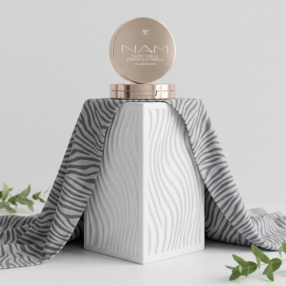 NAM Glow Shield gepresster schützender Puder SPF 25 10 g